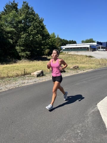 Woman running during crossfit workout wod