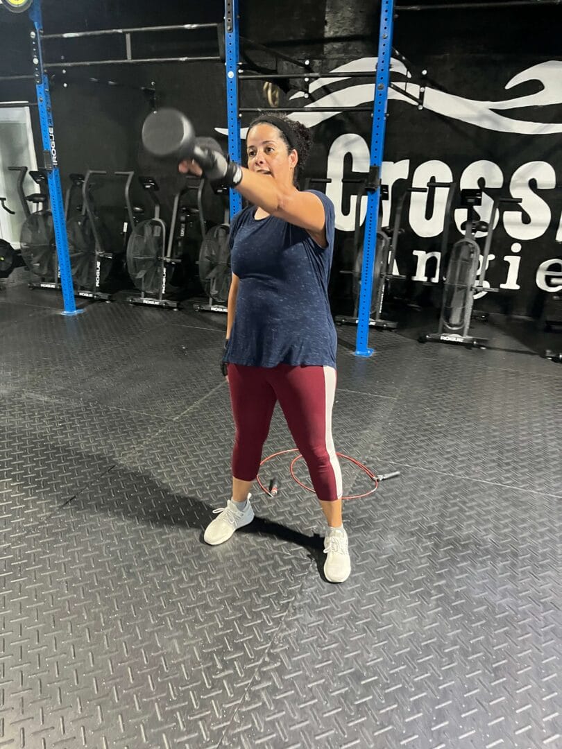 Woman doing functional movements during workout classes at Angier NC