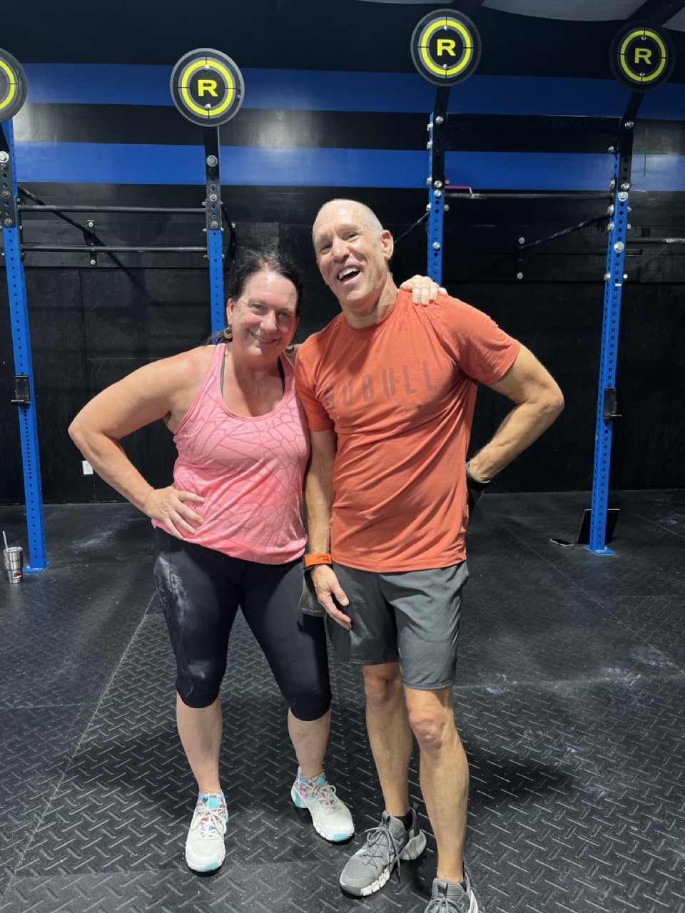 a man and woman posing for a picture at CrossFit Angier